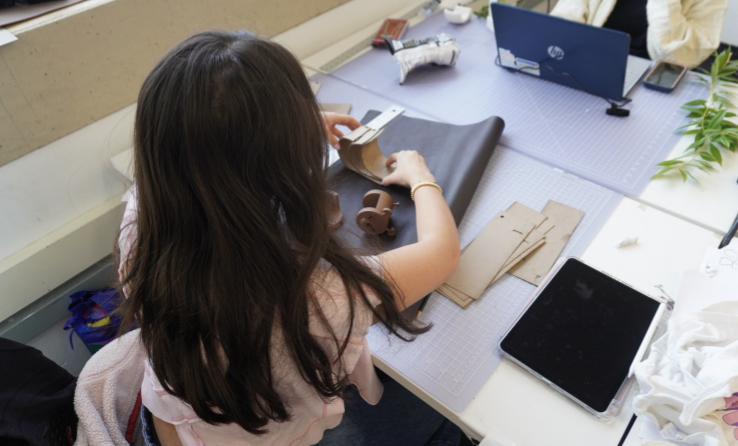 Lillian assembling the flexible leather bridge in the studio