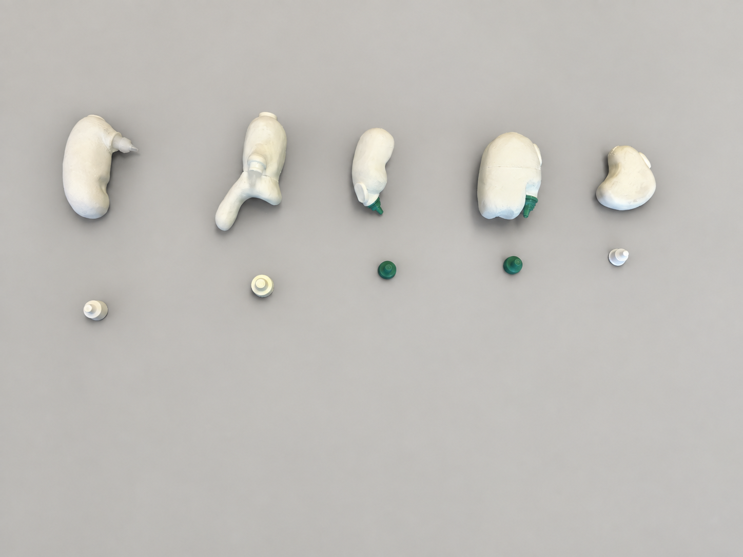 Five distinct white foam eyedrop dispenser appearance models arranged in a row with their nozzle and button components