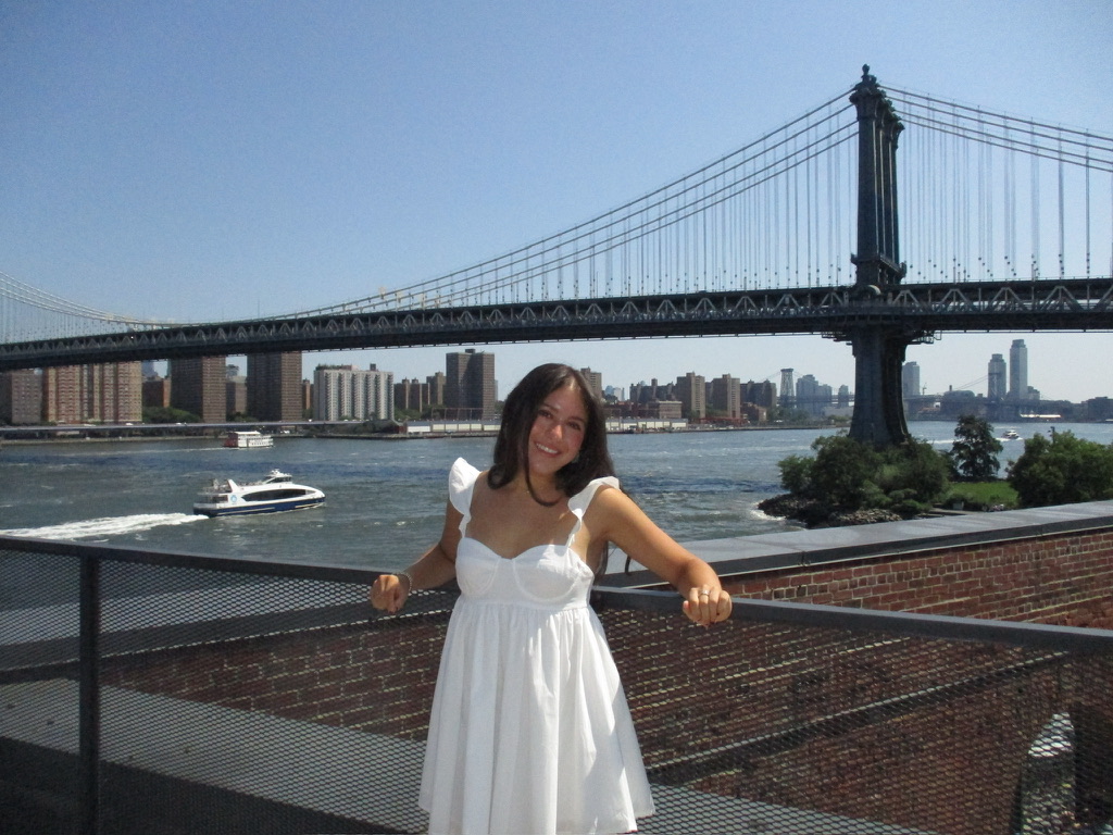 Lillian standing in front of the Manhattan Bridge in New York